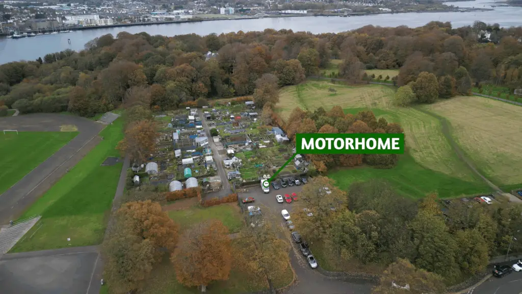 Motorhome highlighted in a car park with a Motorhome Graphic pointing it out. - DigitalNomadNI