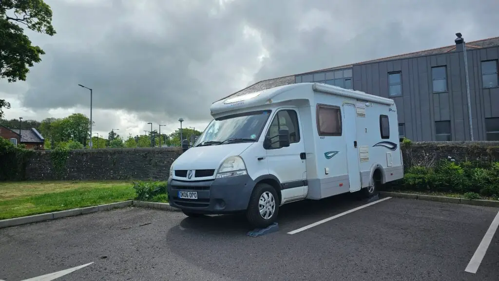 Our motorhome parked in a parking bay on levelling ramps.