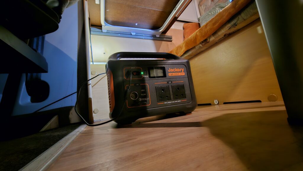 Jackery 1000 hiding under the table in a motorhome. Digital Nomad NI