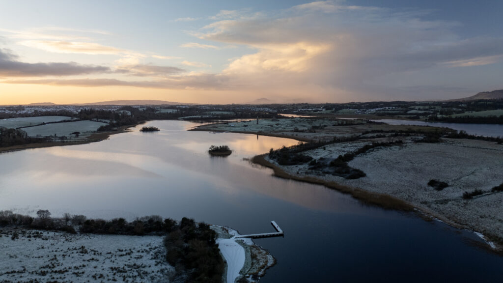 An aerial image of Trory Jetty and the River Erne winding through Enniskillen at sunrise.